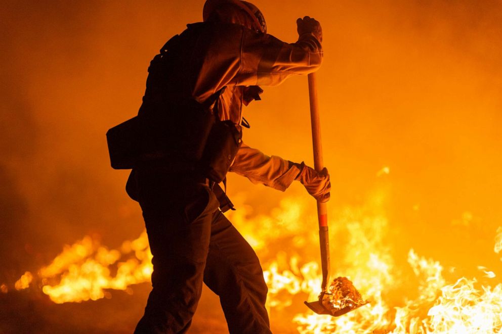 PHOTO: Los Angeles County firefighters, using only hand tools, keep fire from jumping a fire break at the Bobcat Fire in the Angeles National Forest on Sept. 11, 2020, north of Monrovia, Calif.