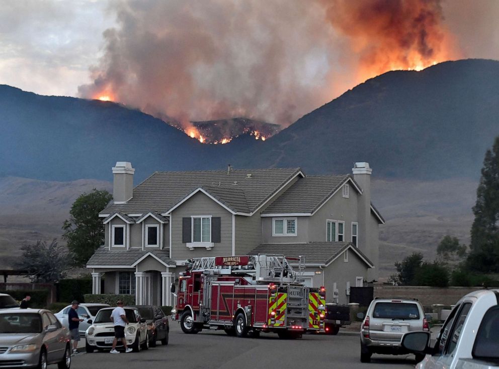 PHOTO: Murrieta Fire Department engine pulls down Sherry Lane as the Tenaja Fire burns in and above Cole Canyon in Murrieta, Calif., Sept. 4, 2019.