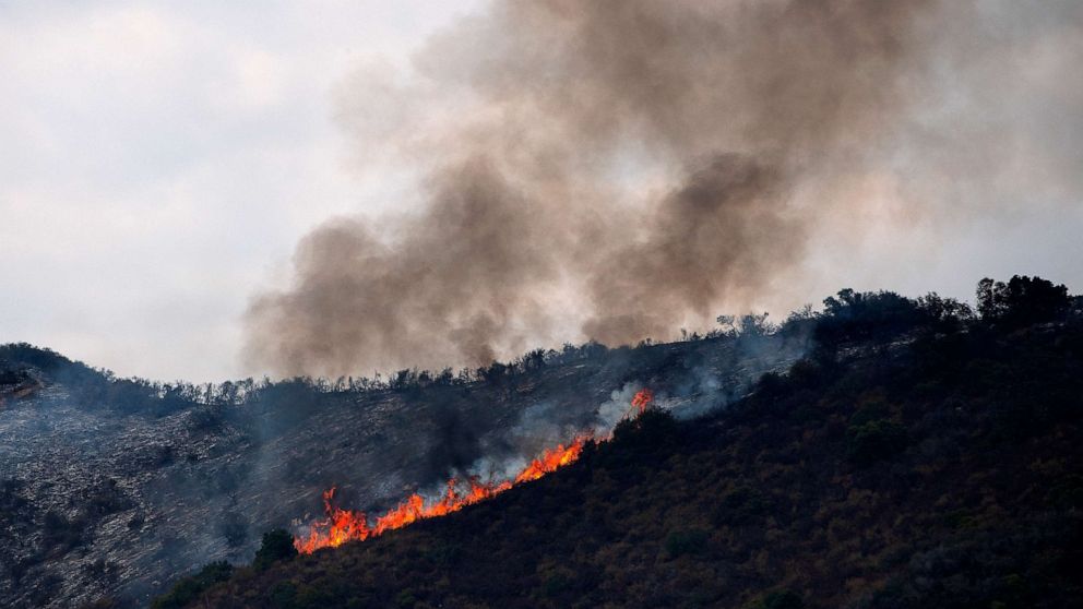PHOTO: Flames and smoke rise as the Tenaja Fire burns near in Murrieta, Calif., Sept. 5, 2019.