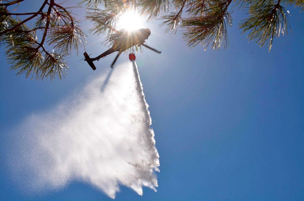 PHOTO: A New Mexico National Guard Aviation soldiers execute water drops as part of firefighting efforts in northern New Mexico, May 1, 2022. 