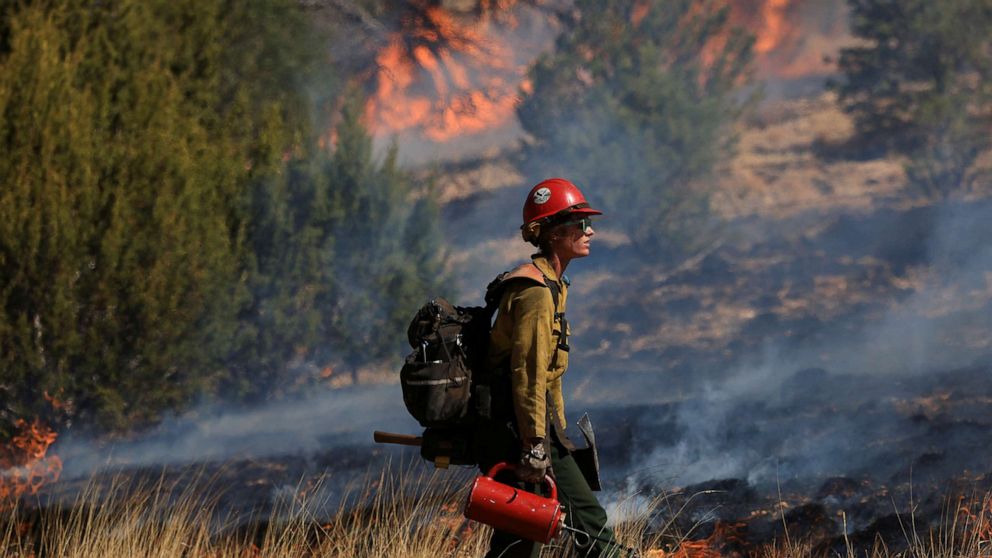 PHOTO: A firefighter conducts a prescribed burn to combat the Hermits Peak and Calf Canyon wildfires, near Las Vegas, N.M. May 4, 2022. 