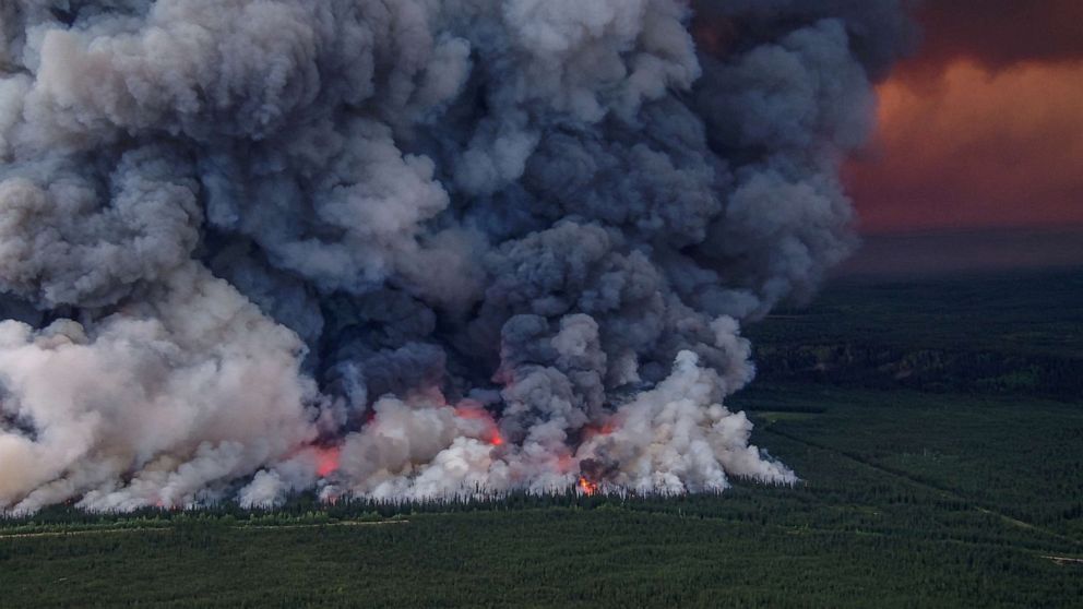 Smoke billows upwards from a planned ignition by firefighters tackling the Donnie Creek Complex wildfire south of Fort Nelson, British Columbia, Canada June 3, 2023.