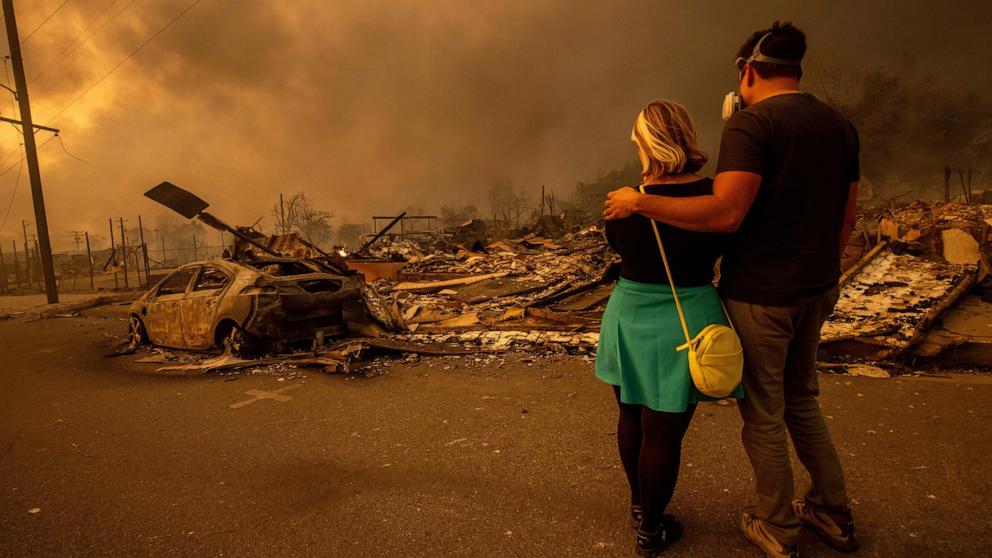 PHOTO: Megan Mantia, and her boyfriend Thomas return to Mantia's fire-damaged home after the Eaton Fire swept through, Jan. 8, 2025, in Altadena, Calif. 