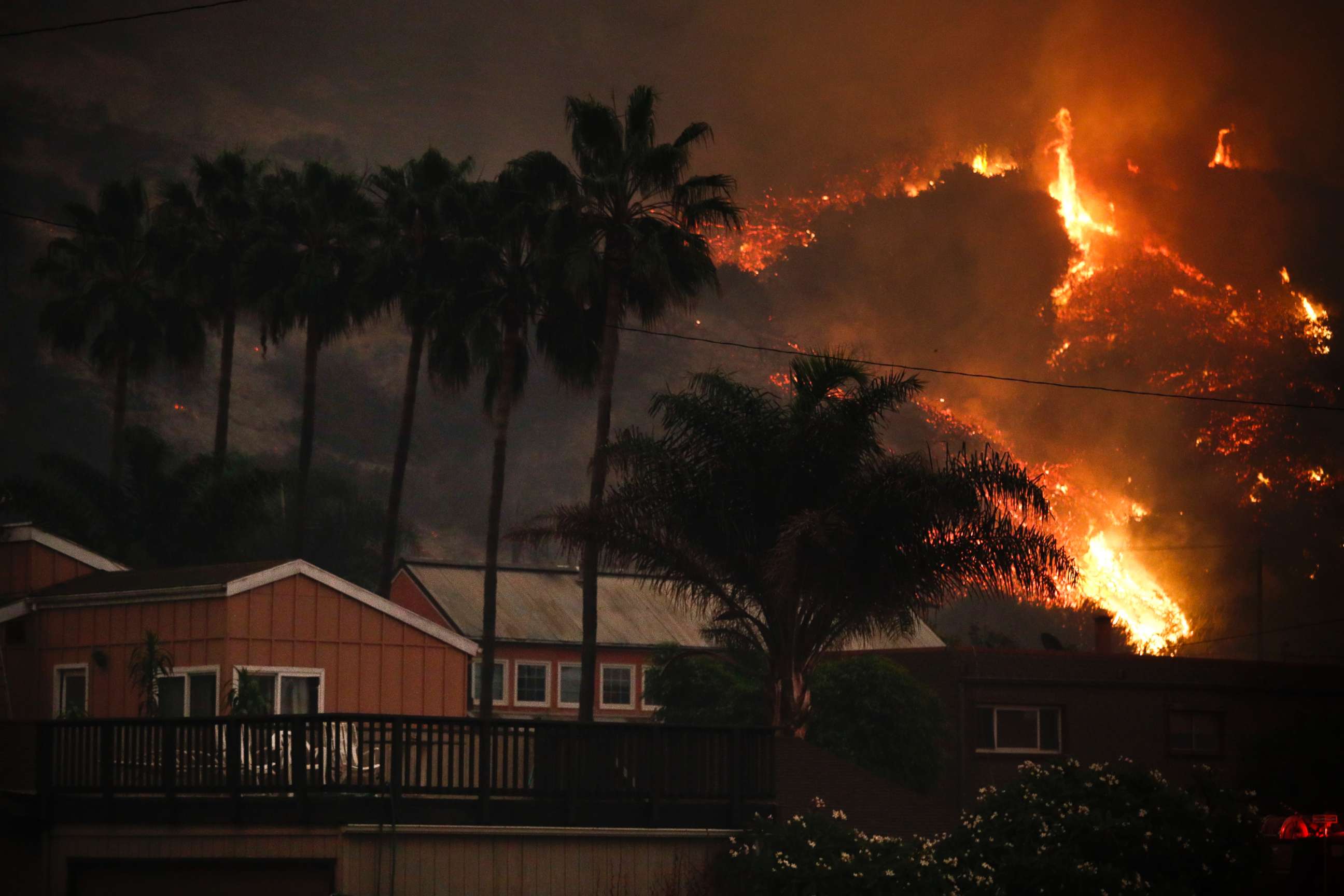 PHOTO: A wildfire threatens homes as it burns along a hillside in La Conchita, Calif., Dec. 7, 2017. 