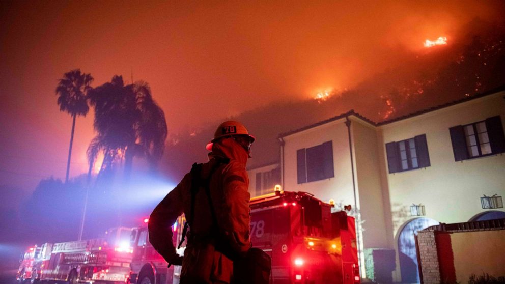 PHOTO: A firefighter watches as flames approach the Mandeville Canyon neighborhood during the Getty fire, Oct. 28, 2019, in Los Angeles.