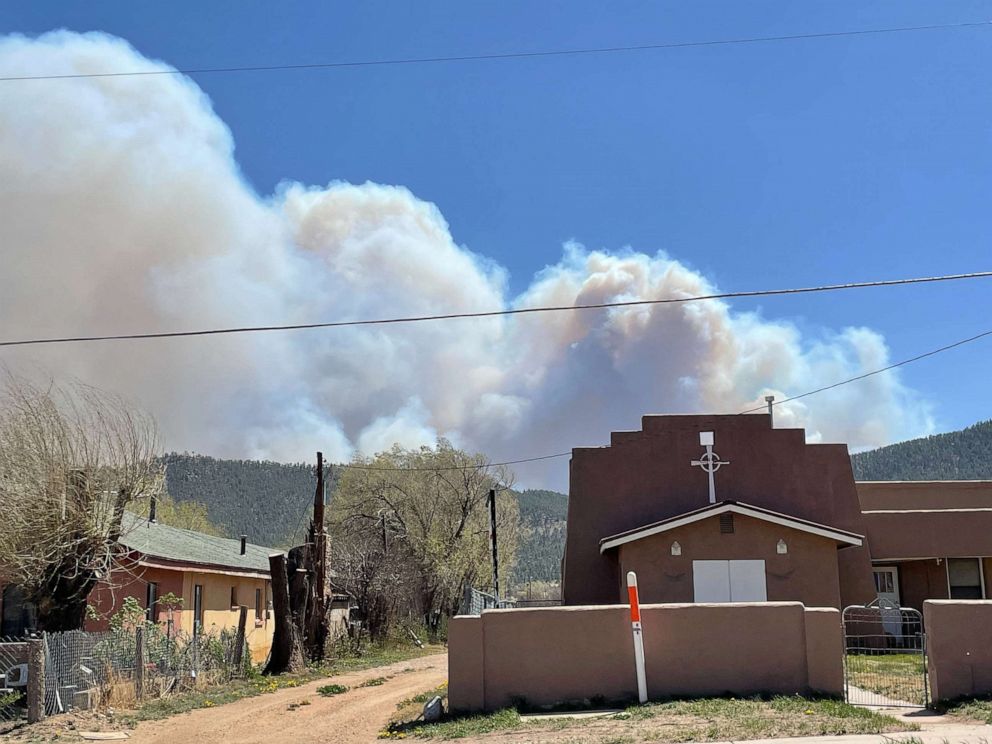 PHOTO: Smoke from the Calf Canyon fire is seen from Mora village, N.M., April 29, 2022.