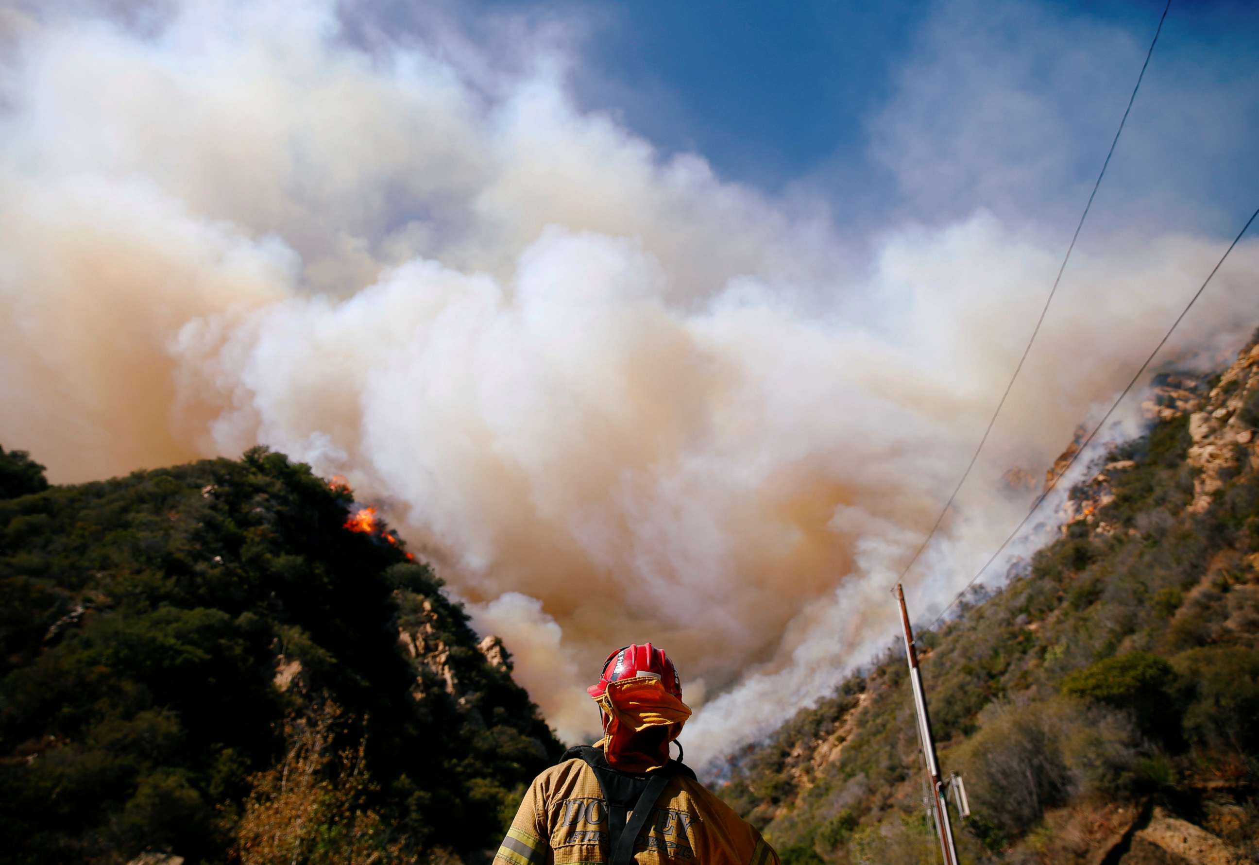 PHOTO: Firefighters battle the Woolsey Fire as it continues to burn in Malibu, Calif., Nov. 11, 2018. 