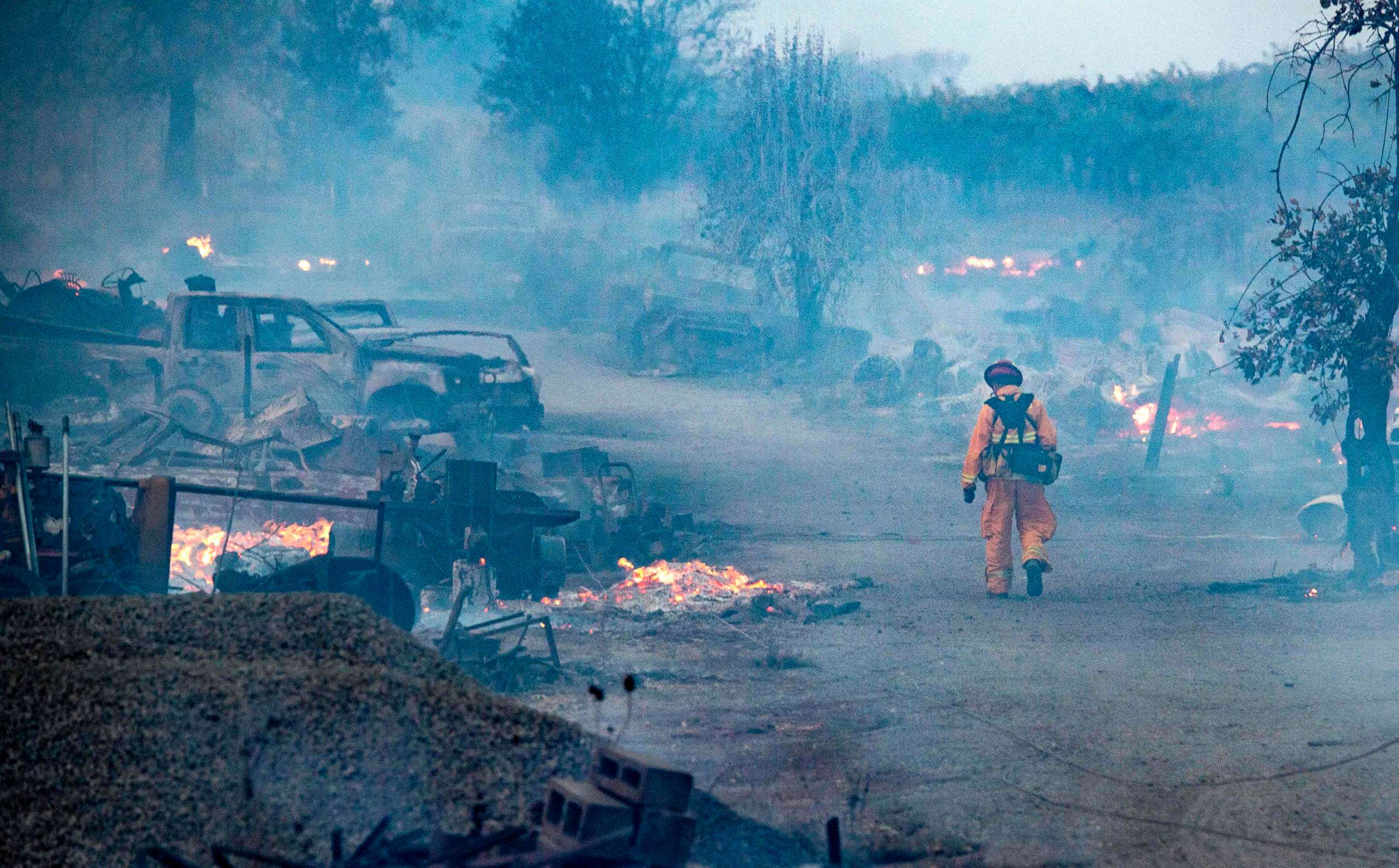 PHOTO: A firefighter walks through a burned property after the Kincade fire tore through Healdsburg, Calif., Oct. 27, 2019.