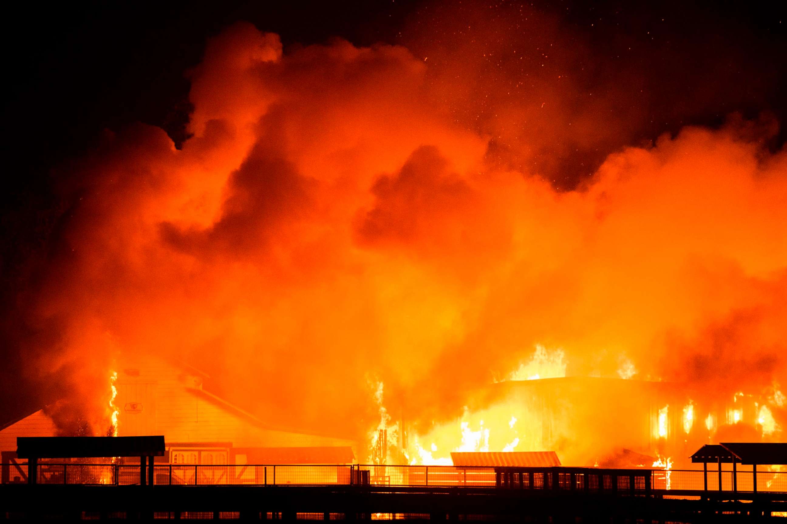 PHOTO: A wind-driven fire burns a structure on a farm during the Kincade fire in Windsor, Calif., Oct. 27, 2019.