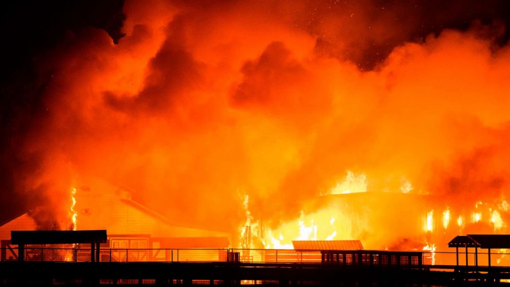 PHOTO: A wind-driven fire burns a structure on a farm during the Kincade fire in Windsor, Calif., Oct. 27, 2019.