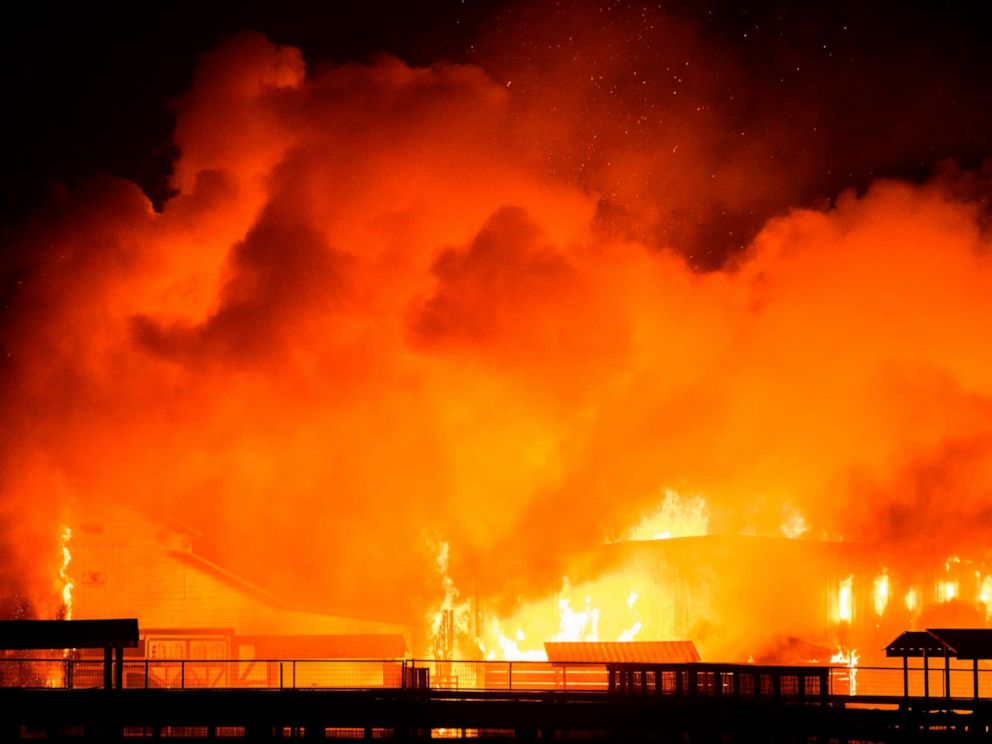 PHOTO: A wind-driven fire burns a structure on a farm during the Kincade fire in Windsor, Calif., Oct. 27, 2019.