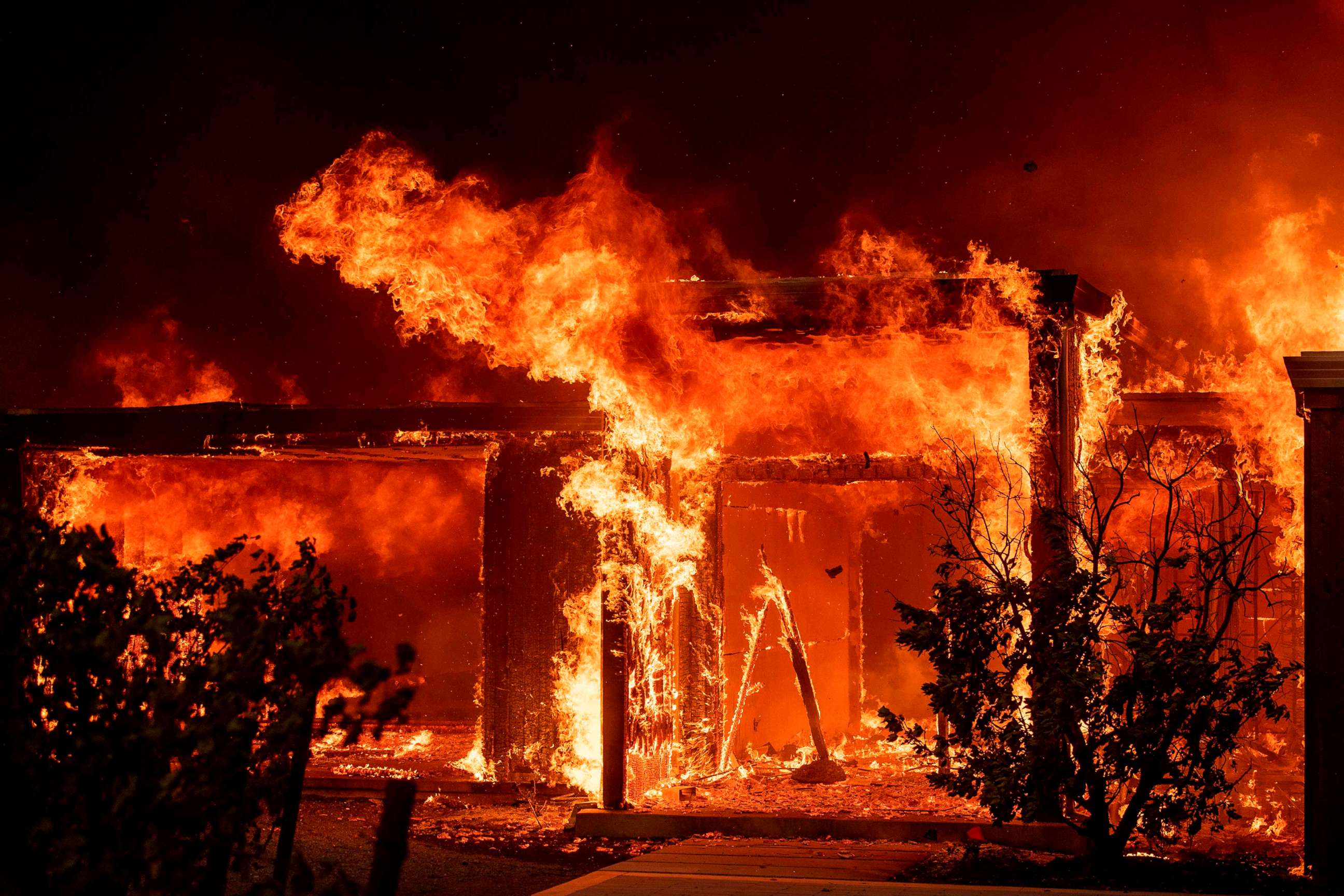 PHOTO: Flames consume a home during the Kincade fire as flames race through Healdsburg, Calif., Oct. 27, 2019.