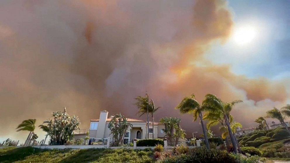 PHOTO: Smoke from a wildfire rises above a residential area in Laguna Niguel, Calif., May 11, 2022.
