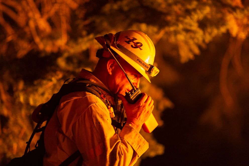 PHOTO: Los Angeles County firefighters, using only hand tools, keep fire from jumping a fire break at the Bobcat Fire in the Angeles National Forest, Sept. 11, 2020, in Monrovia, California.