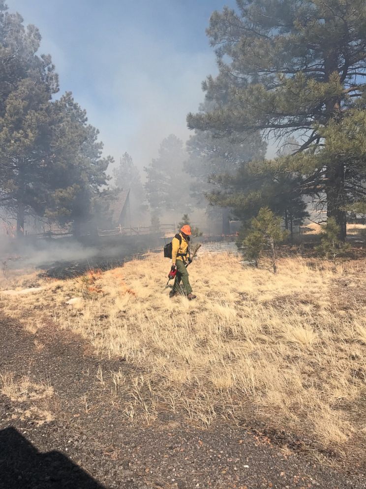 PHOTO: Firefighter at the site where a drone caught fire in Arizona's Coconino National Forest. 