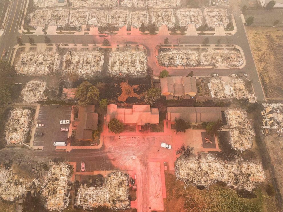 PHOTO: In this aerial view from a drone, structures destroyed by wildfire and others spared by fire retardant are seen, Sept. 12, 2020, in Talent, Oregon.