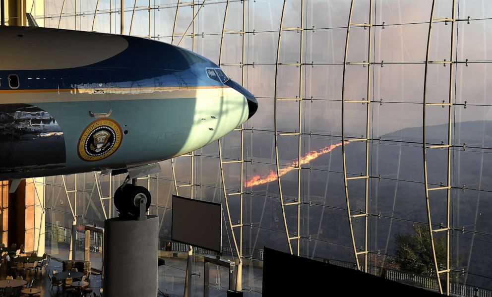 PHOTO: President Ronald Reagan's Air Force One sits on display at the Reagan Library as the Easy Fire burns in the hills, Oct. 30, 2019, in Simi Valley, Calif.