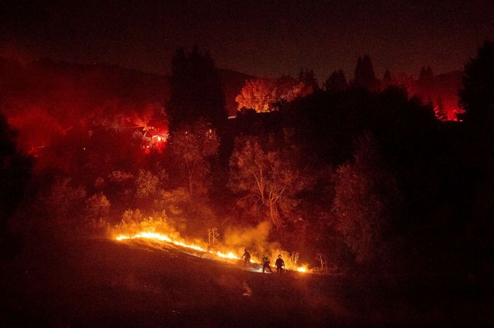 PHOTO: Firefighters work to contain a wildfire burning off Merrill Dr. in Moraga, Calif., Oct. 10, 2019. Police have ordered evacuations as the fast-moving wildfire spread in the hills of the San Francisco Bay Area community.