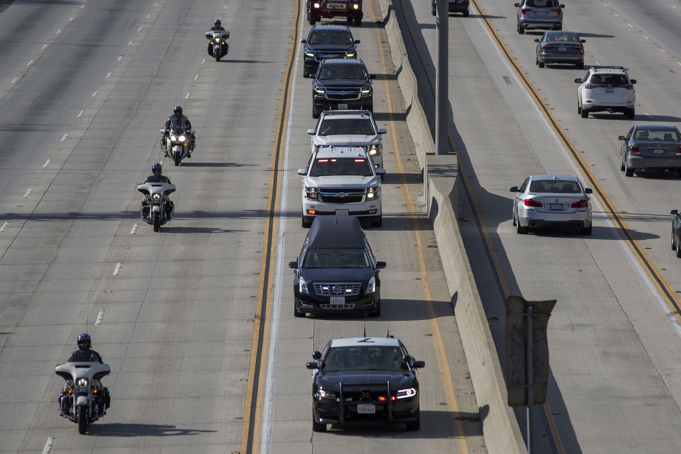 PHOTO: A procession carries the body of Cory Iverson, 32, a fire engineer for Cal Fire San Diego who died fighting the Thomas Fire, from Ventura to San Diego, Dec. 17, 2017, in Pasadena, Calif.