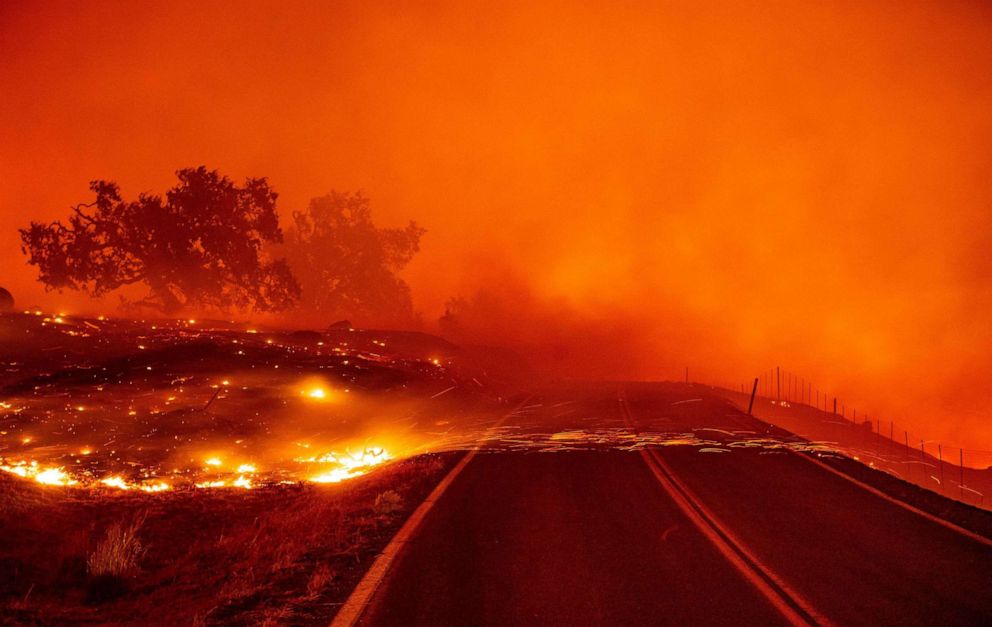 PHOTO: Embers blow across a road during the Kincade fire near Geyserville, Calif., Oct. 24, 2019.