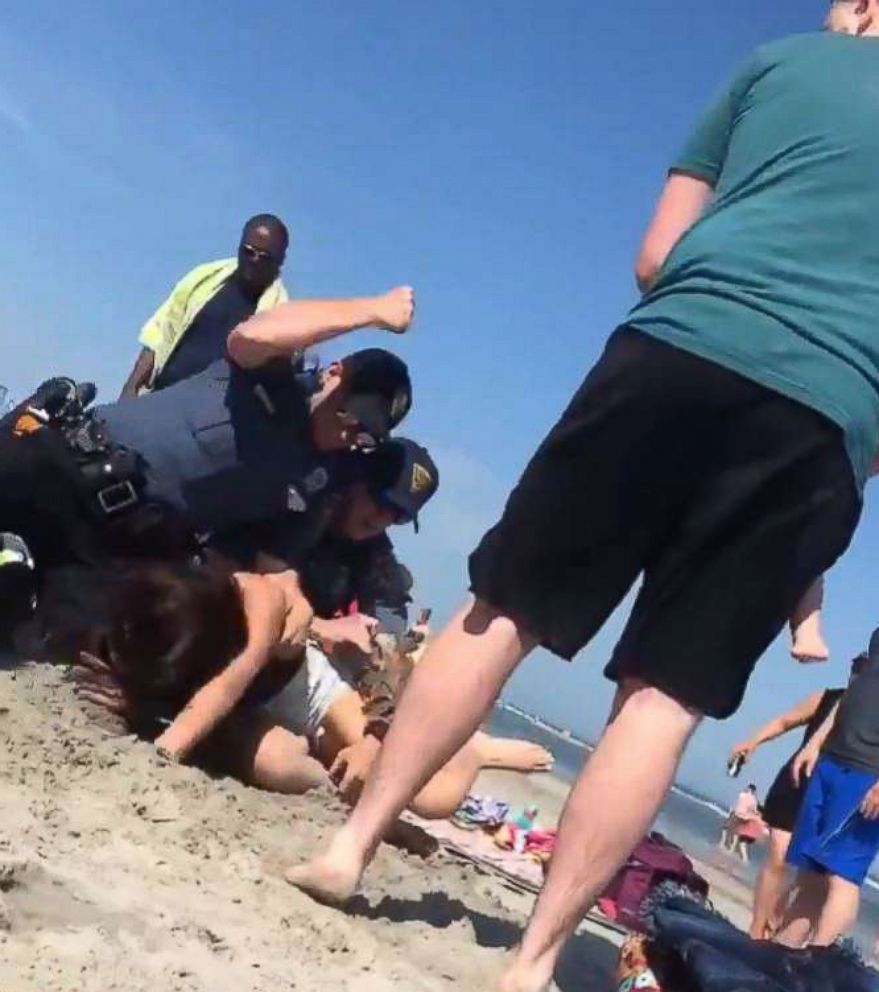 PHOTO: A video made its rounds on social media showing police officers wrestling a woman to the ground and punching her in the head at a beach in Wildwood, N.J., May 26, 2018. 