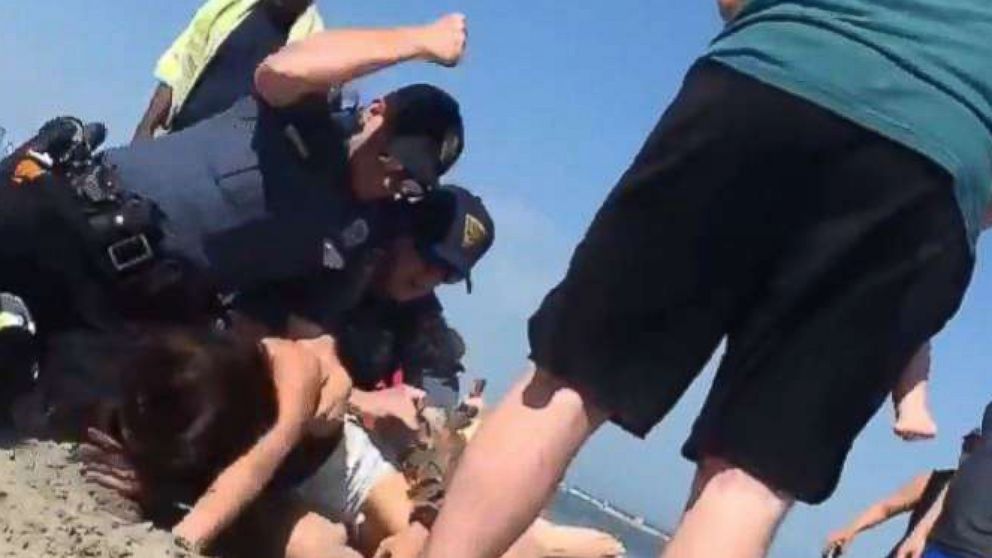 VIDEO: Cop caught on video punching beachgoer in head