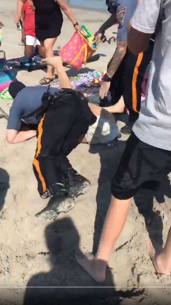 PHOTO: A video made its rounds on social media showing police officers wrestling a woman to the ground and punching her in the head at a beach in Wildwood, N.J., May 26, 2018.