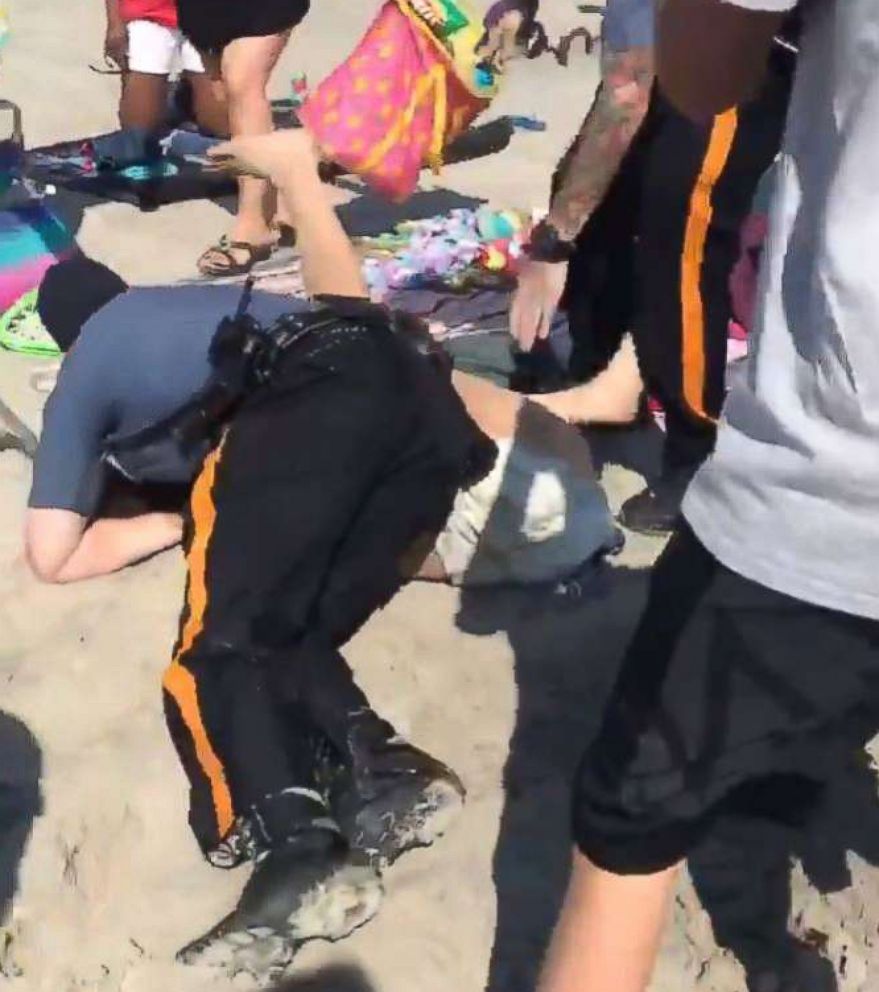 PHOTO: A video made its rounds on social media showing police officers wrestling a woman to the ground and punching her in the head at a beach in Wildwood, N.J., May 26, 2018.