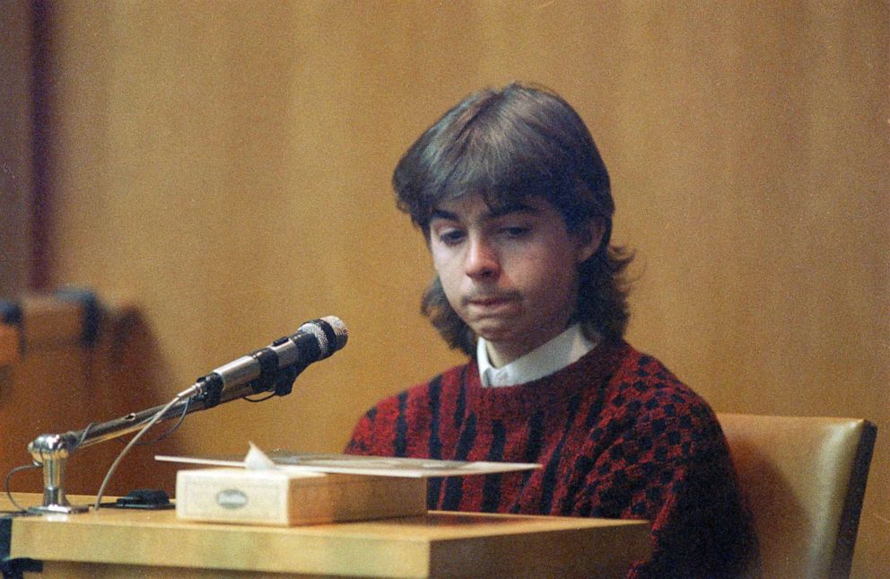 PHOTO: William Flynn, 17, looks at state police photo of Gregory Smart, during his testimony in Exeter, N.H., March 12, 1991.
