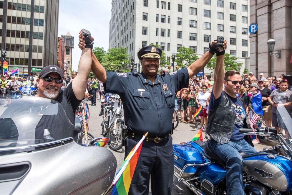 PHOTO: Boston Police Superintendent-in-Chief William Gross holds hands with two motorcycle riders at the start of the 2018 Boston Pride Parade, June 9, 2018, in Boston.