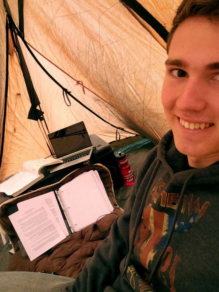 PHOTO: Cadet William Taylor takes a selfie in his tent where he is finishing online classes at the Virginia Military Institute. The tent's location is where Taylor found the strongest cell signal for his phone's hotspot.