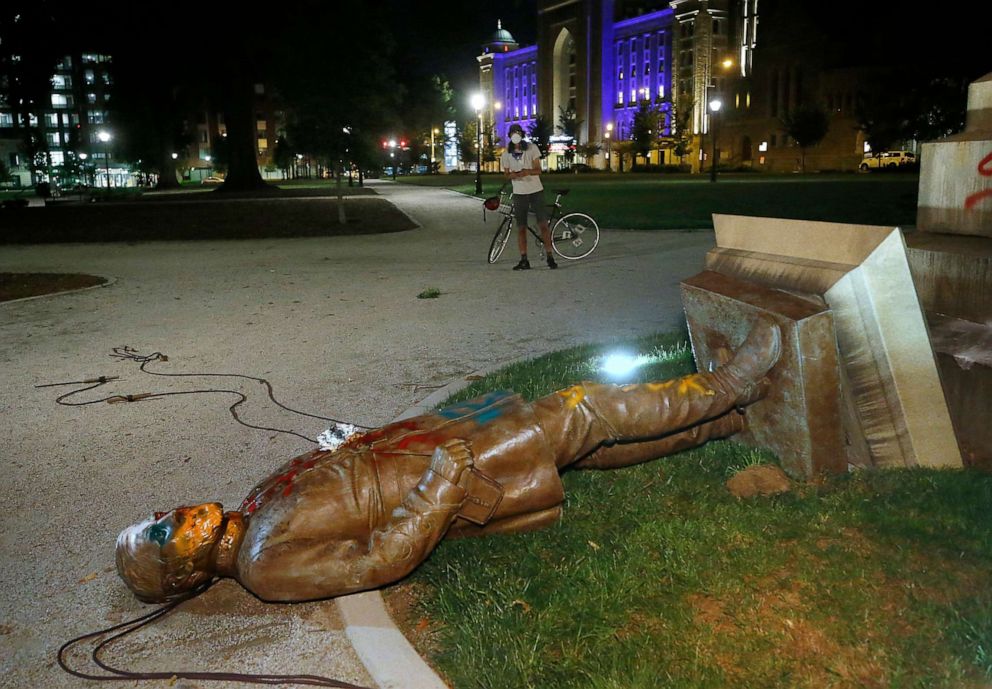 PHOTO: The statue of Confederate Gen. Williams Carter Wickham lies on the ground after protesters pulled it down in Monroe Park in Richmond, Va., June 6, 2020. 