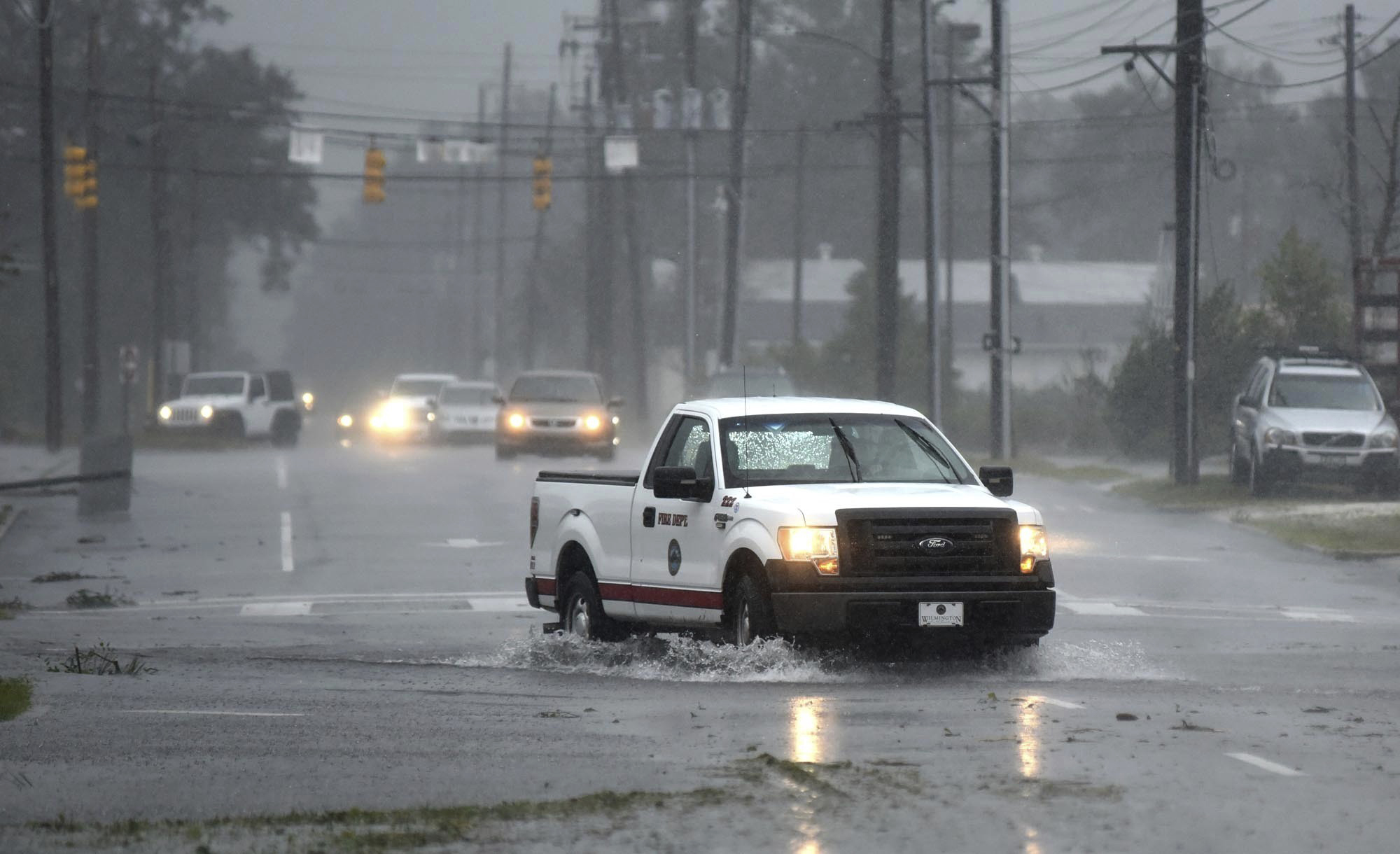 PHOTO: A vehicle with the Wilmington Fire Department drives through a flooded street from Florence, now a tropical storm in Wilmington, N.C., Saturday, Sept. 15, 2018.
