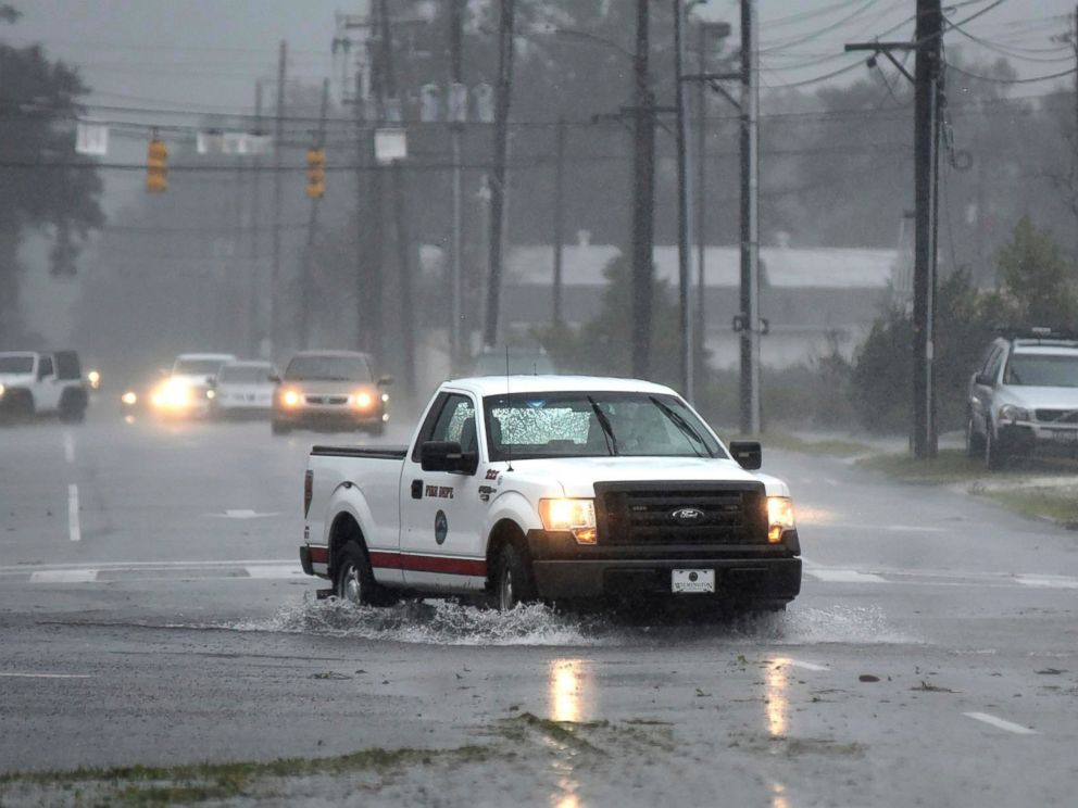 PHOTO: A vehicle with the Wilmington Fire Department drives through a flooded street from Florence, now a tropical storm in Wilmington, N.C., Saturday, Sept. 15, 2018.
