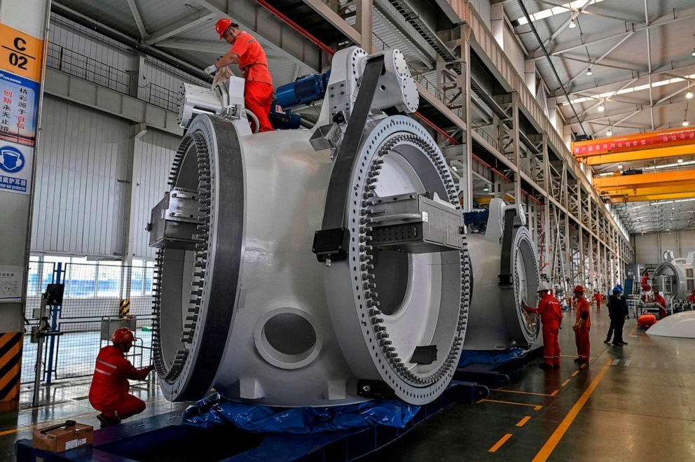 PHOTO: Workers at a plant during the production process of wind turbines during a government organized tour at Goldwind Technology in Yancheng, in Jiangsu province, Oct. 14, 2020.