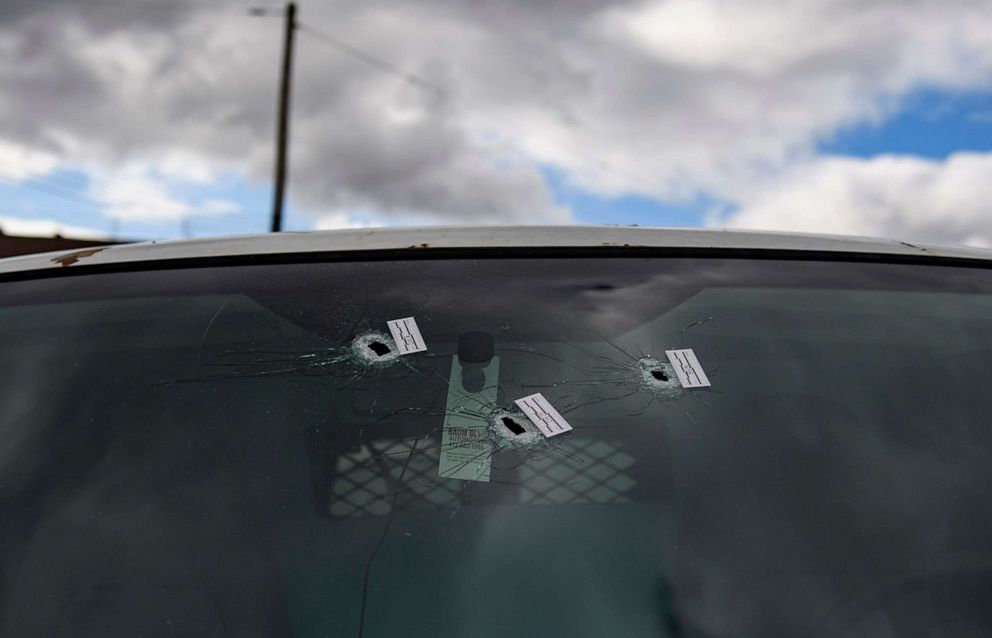 PHOTO: Bullet holes are seen in a van parked outside an Airbnb apartment rental, April 17, 2022, following a shooting at a house party in Pittsburgh.