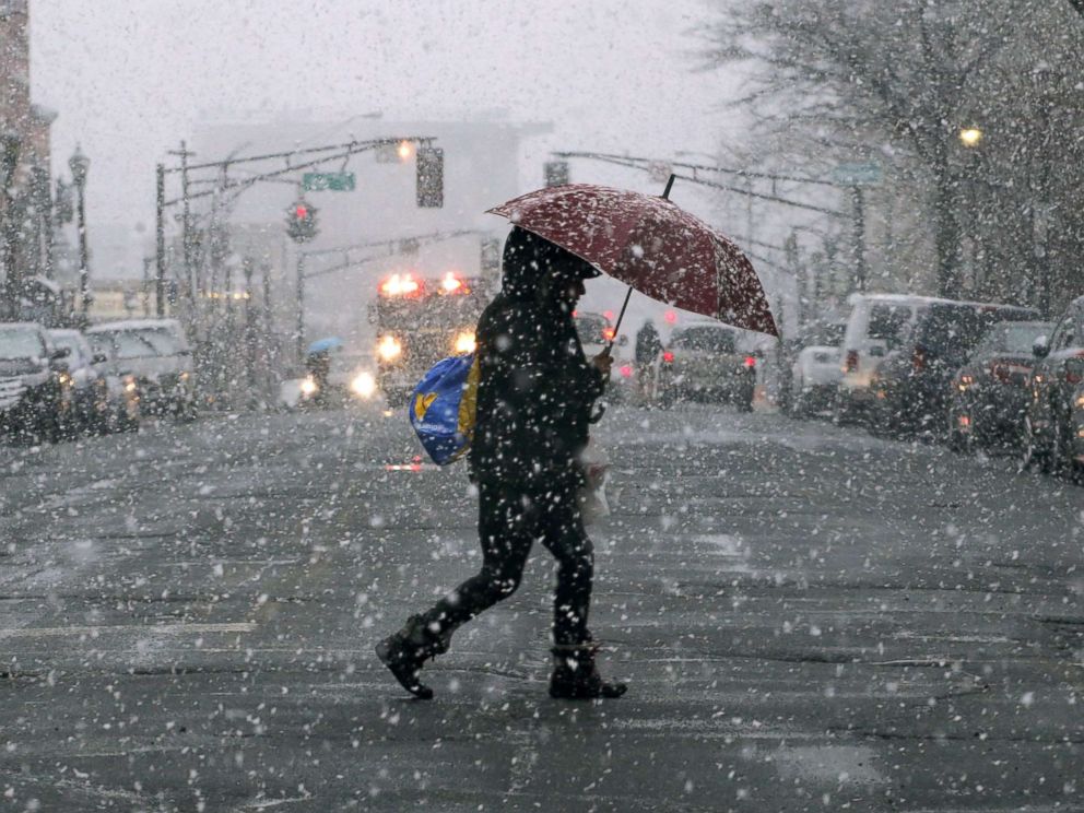 PHOTO: A woman holds an umbrella as snow falls on March 7, 2018 in Hoboken, N.J.
