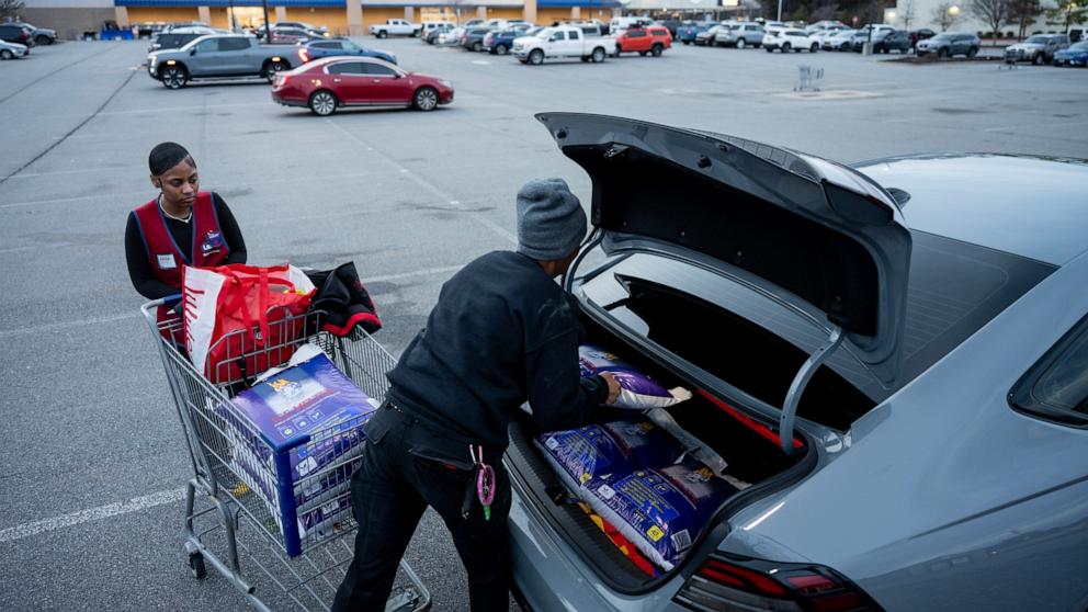 PHOTO: A customer loads ice melt into their car at Lowes, January 22, 2026 in Little Rock, Arkansas.
