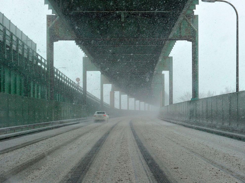 PHOTO: Snow falls causing roads to be covered quickly after plows clean them during a March noreaster, March 13, 2018, in Boston.