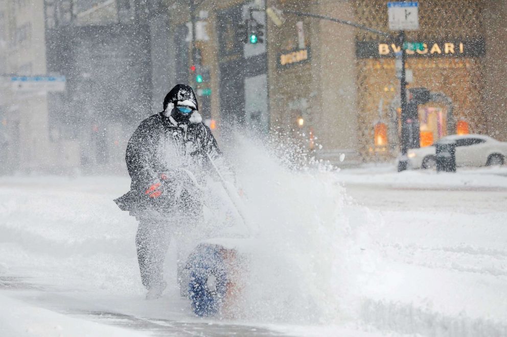 PHOTO: A worker clears a street during a snow storm in the Manhattan, Feb. 1, 2021.