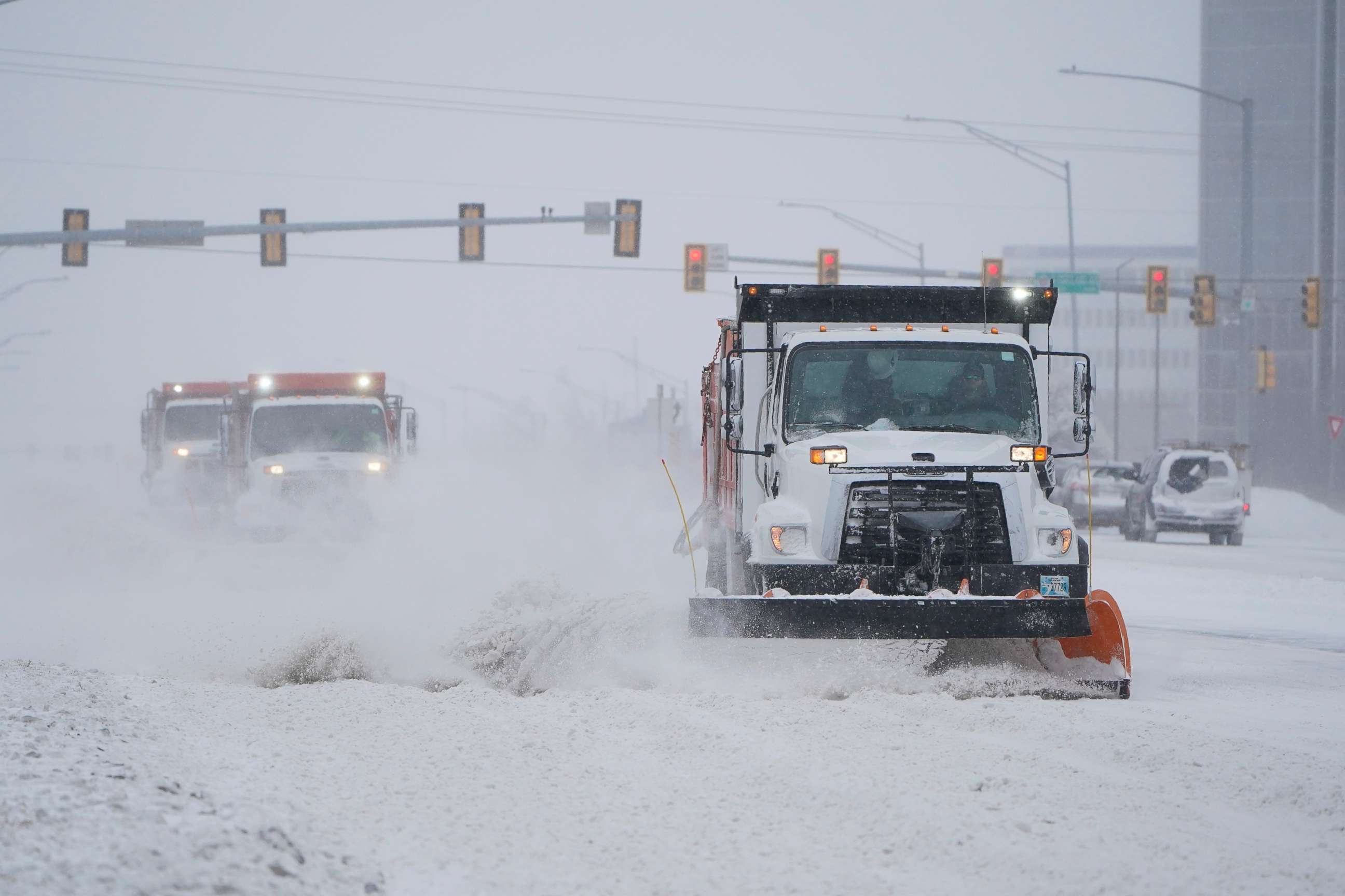 PHOTO: Snowplows works to clear the road during a winter storm Sunday, Feb. 14, 2021, in Oklahoma City. Snow and ice blanketed large swaths of the U.S. on Sunday, prompting canceled flights, making driving perilous and reaching into the Texas Gulf Coast.
