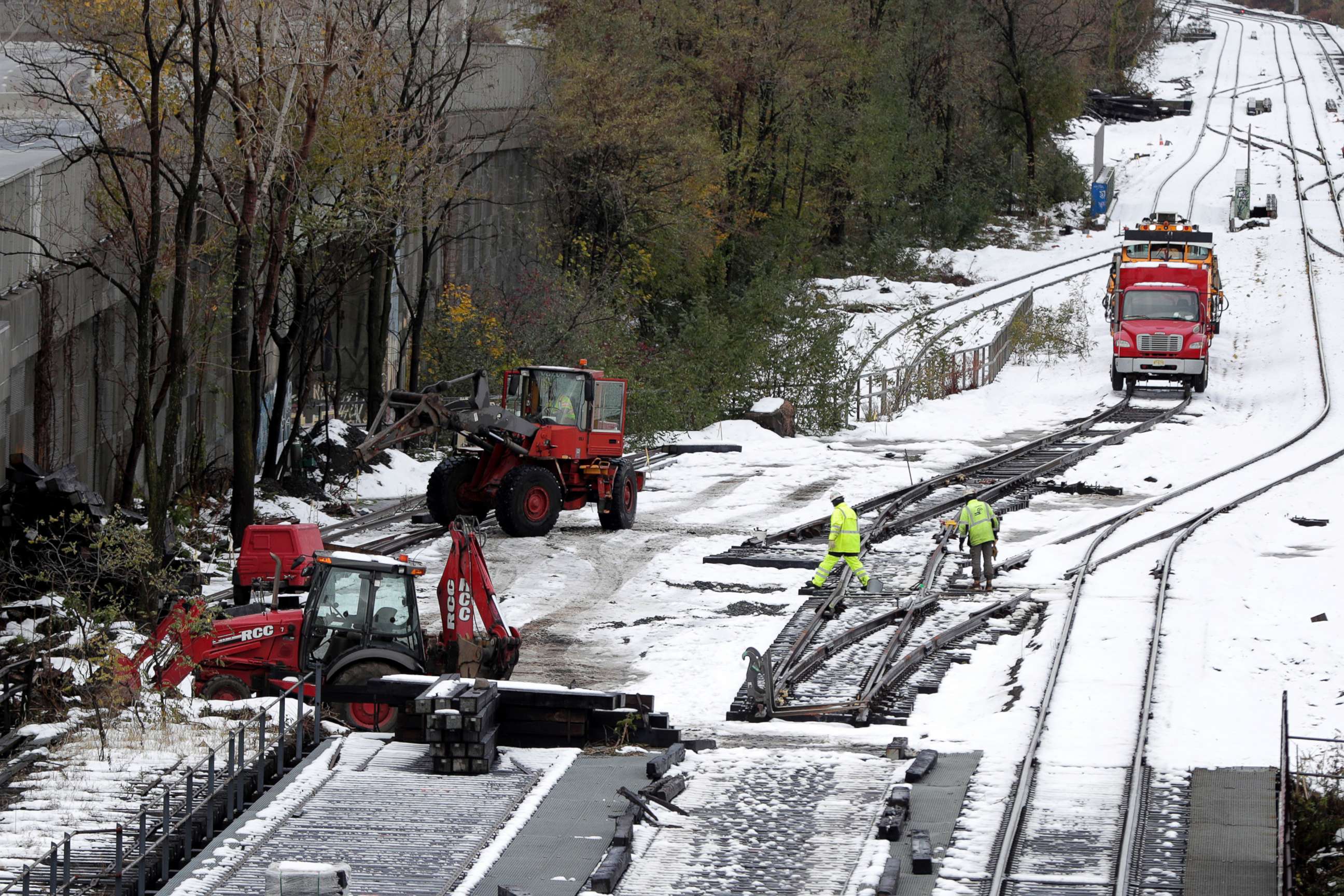 PHOTO: Workers inspect rail lines along Route 440 following a snowstorm, Friday, Nov. 16, 2018, in Jersey City, N.J.