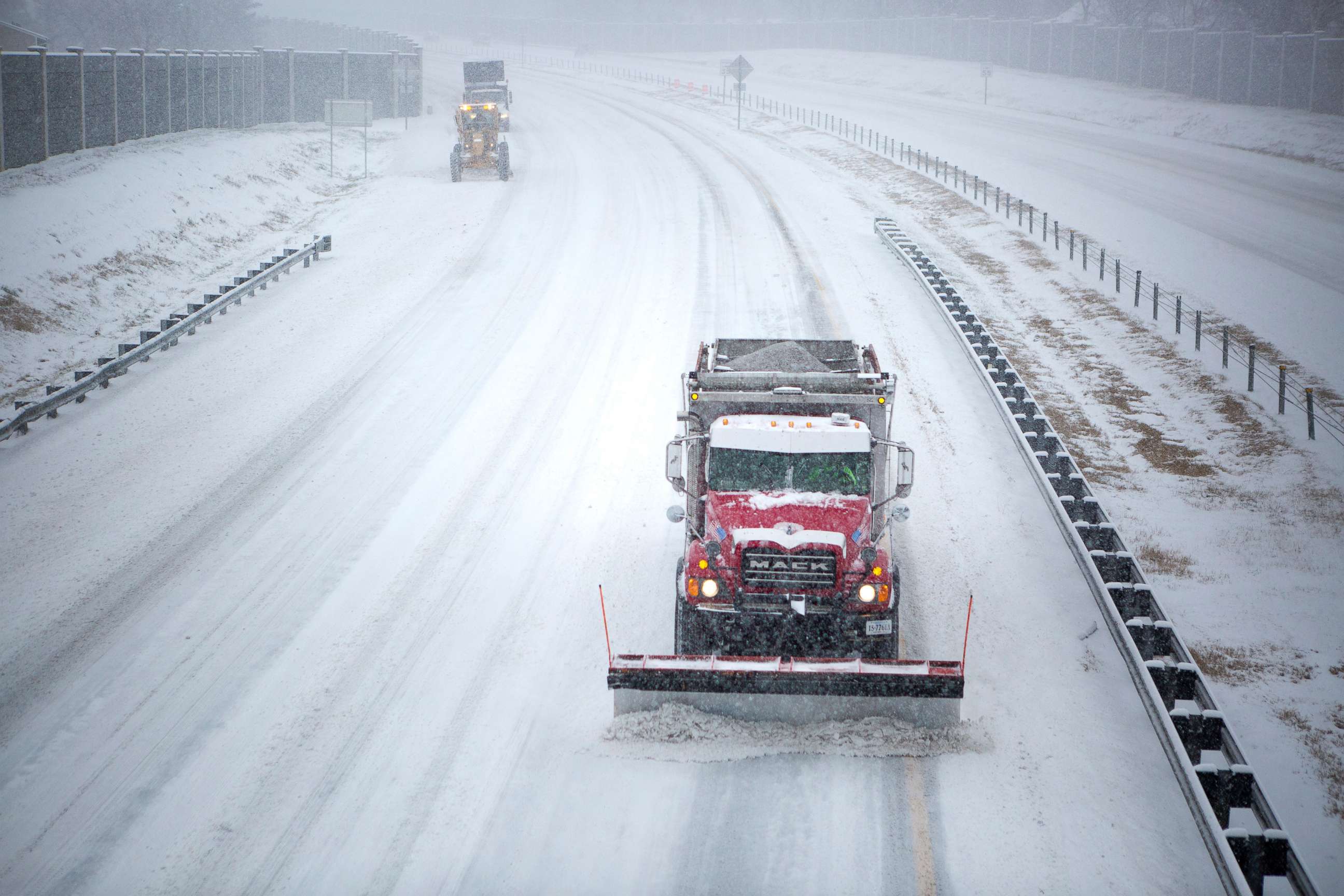 PHOTO: Plows work on Interstate 581 at the Liberty Road NW overpass during the snow storm Jan. 16, 2022, in Roanoke, Va.