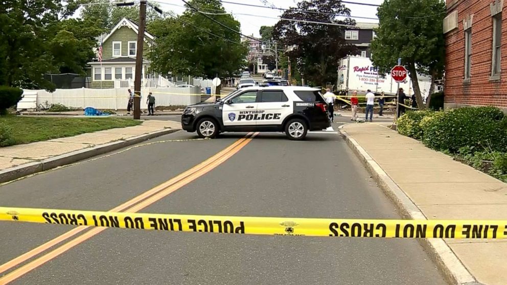 PHOTO: Scene where a retired state trooper and a woman were killed in Winthrop, Massachusetts on June 26, 2021, after a suspect rammed a stolen truck into a house, police said.