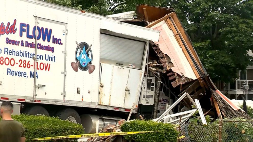 PHOTO: Scene where a retired state trooper and a woman were killed in Winthrop, Massachusetts on June 26, 2021, after a suspect rammed a stolen truck into a house, police said.