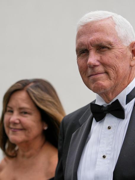 Former Vice President Mike Pence arrives with his wife, Karen Pence, at the JFK Library where he will receive the John F. Kennedy Profile in Courage Award, Sunday, May 4, 2025, in Boston. (AP Photo/Robert F. Bukaty)