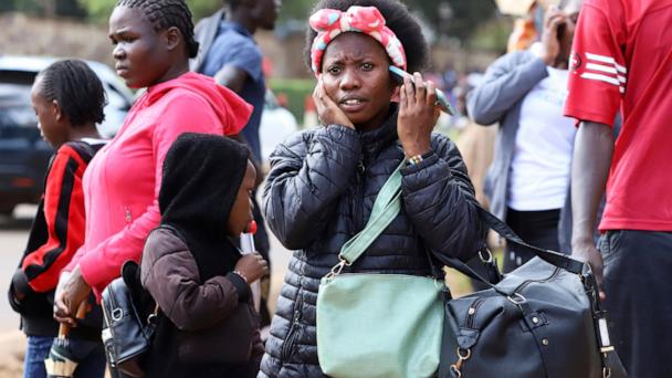 A woman talks on her mobile phone in downtown Nairobi, Kenya, Sept. 13, 2025. (AP Photo/Andrew Kasuku)