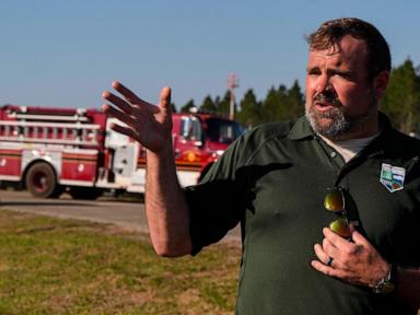 Southern US wildfires force residents to flee, leaving them unsure if their homes are standing