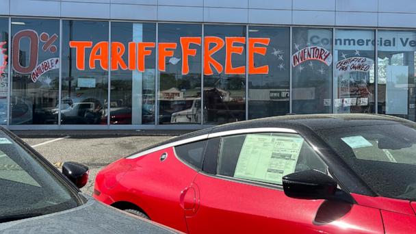 FILE - A Tariff Free sign to attract vehicle shoppers is at an automobile dealership in Totowa, N.J., on April 30, 2025. (AP Photo/Ted Shaffrey)