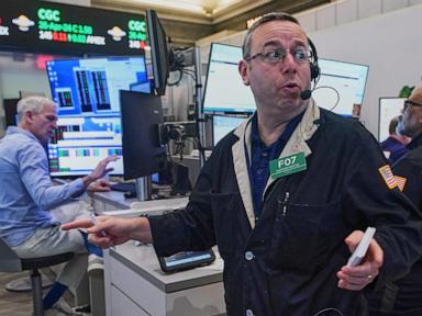 Asian shares are mixed and oil gains more than $1 as Iran talks remain in flux